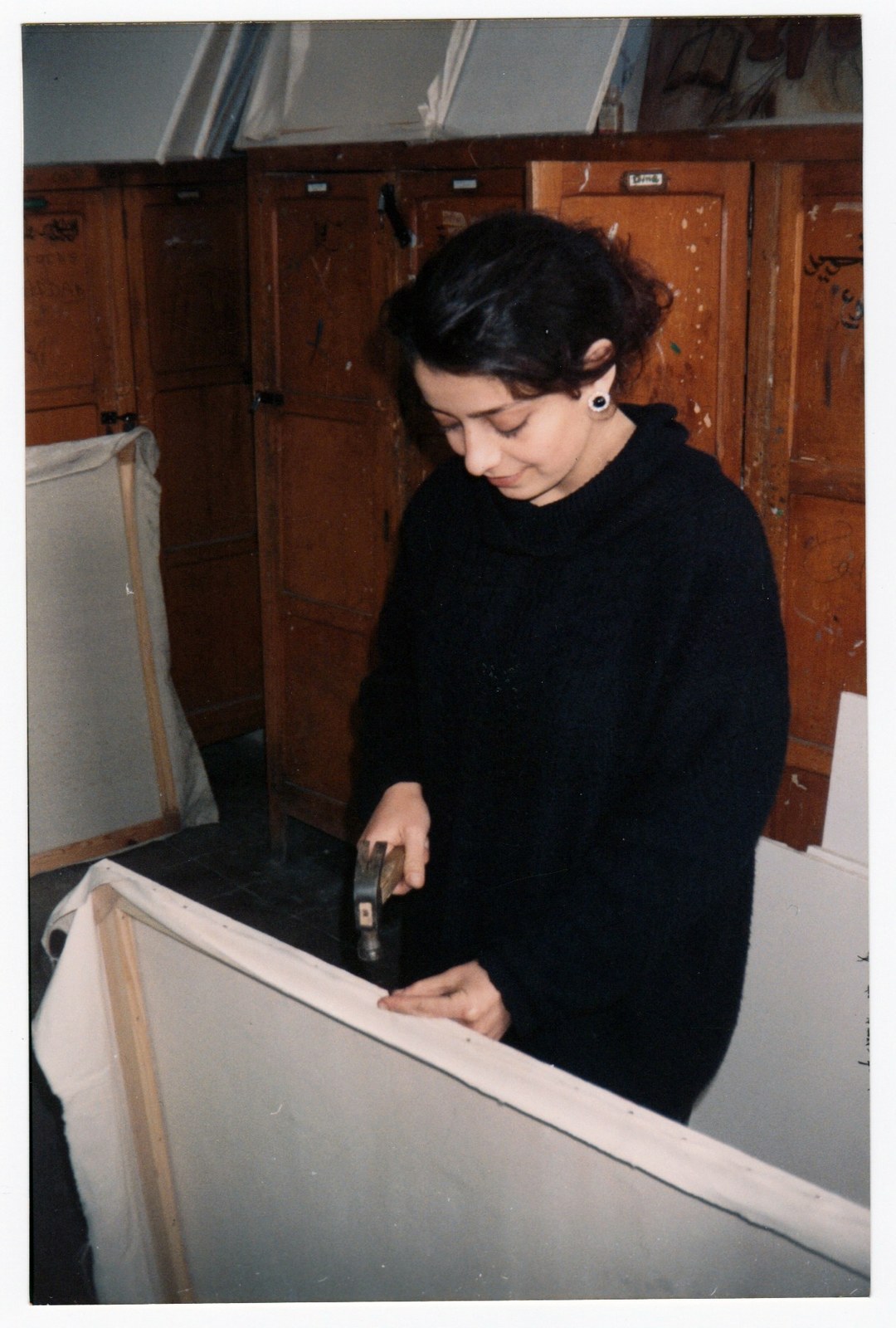 Stretching a canvas in the studio · 10